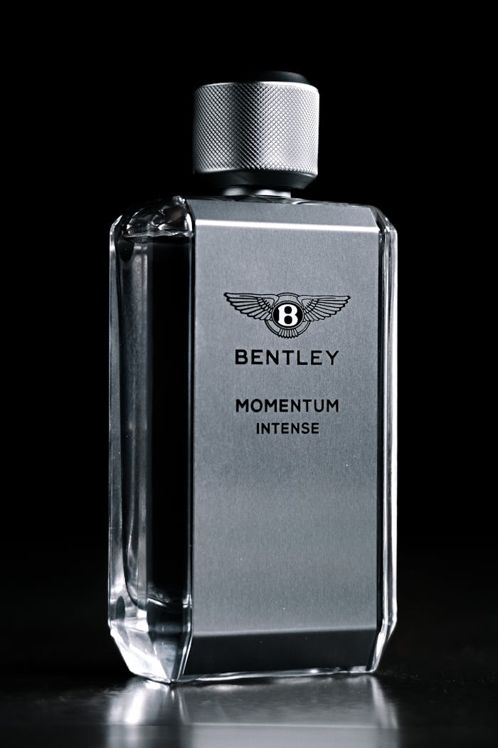 Luxury Bentley Momentum Intense cologne bottle in a sleek design, ideal for fragrance enthusiasts.
